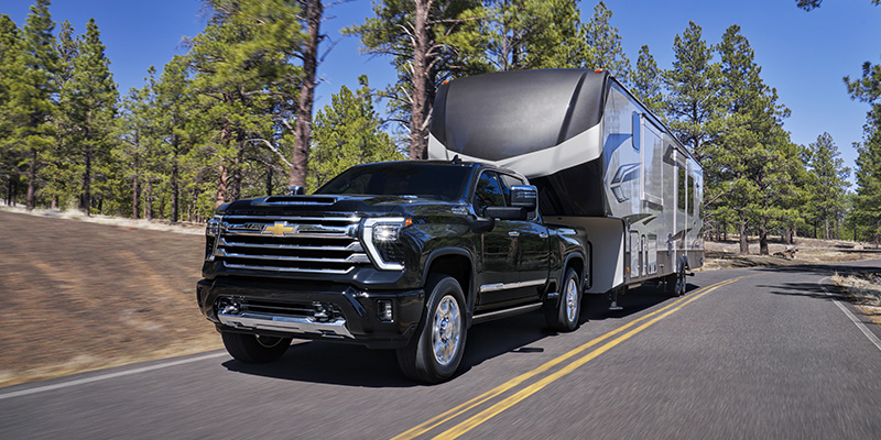 2020 Chevrolet Silverado 2500HD towing an RV in Waco, TX, showcasing its powerful towing capabilities.